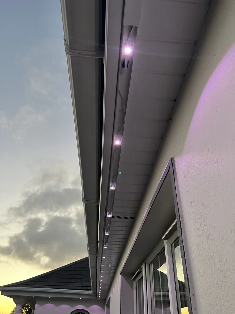 Geal Govee installation with a section of PVC lid removed to reveal lights and wiring inside the U-shaped channel